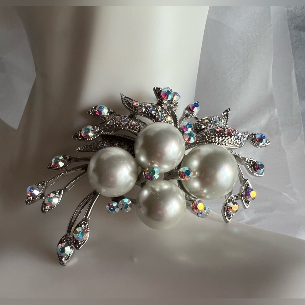 Brooch with crystal and faux pearls. This piece is about 20 years old
